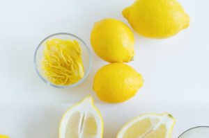 Whole and cut lemons, ready to be zested